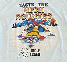 Load image into Gallery viewer, 82’ Wolf Creek “Taste the High Country” Light Blue T-Shirt